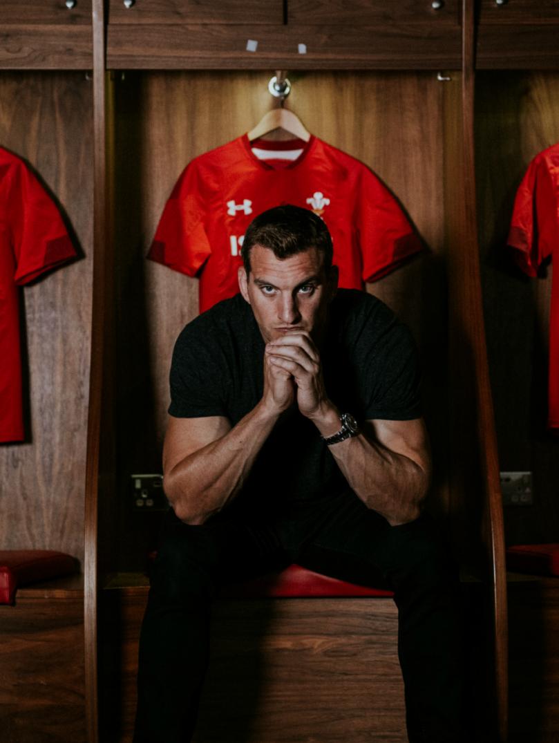 Sam Warburton in the Wales rugby team changing room staring down the lens of the camera.
