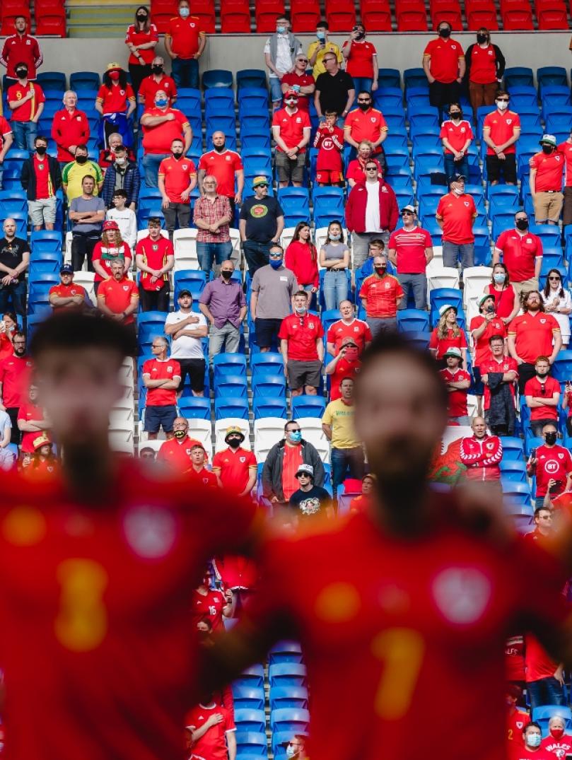 Wales fans sing the anthem during the international challenge match, Wales v Albania at the Cardiff City Stadium, Cardiff.