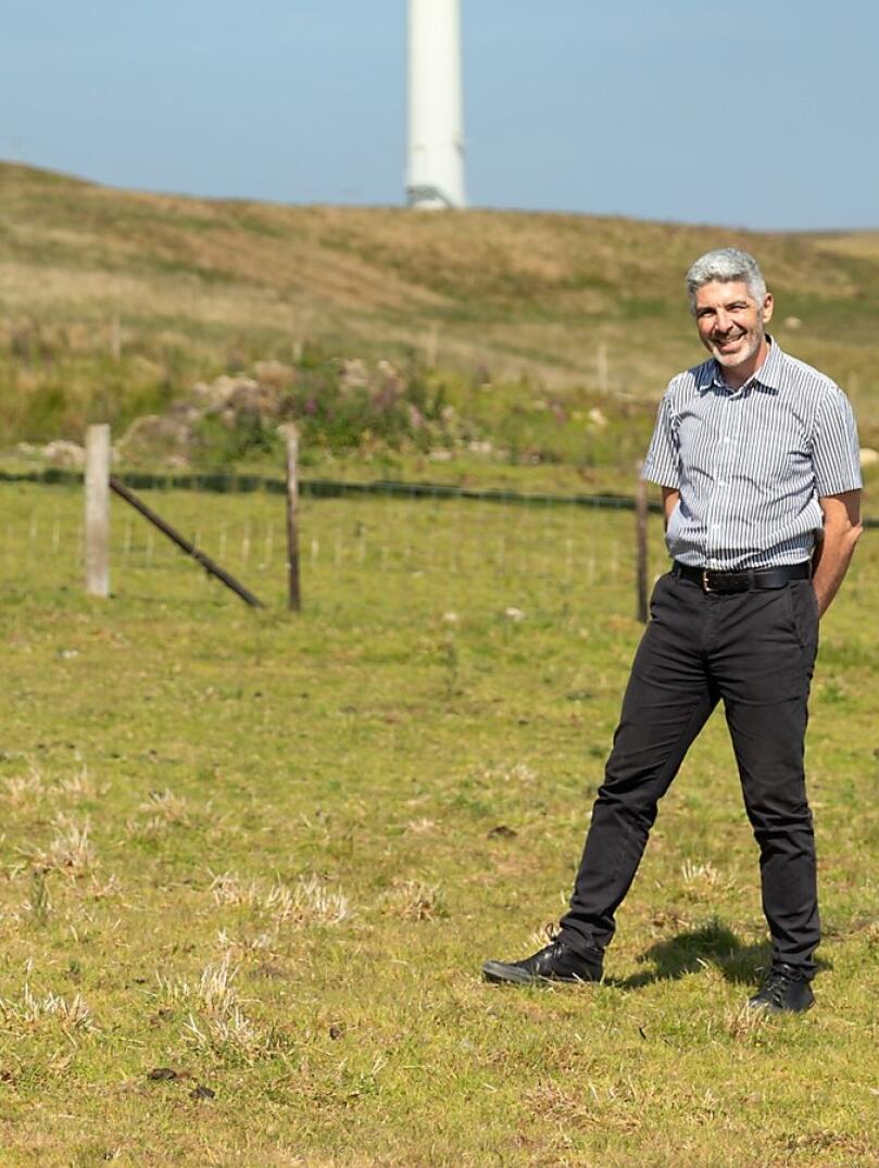 Derek  Walker standing in a field