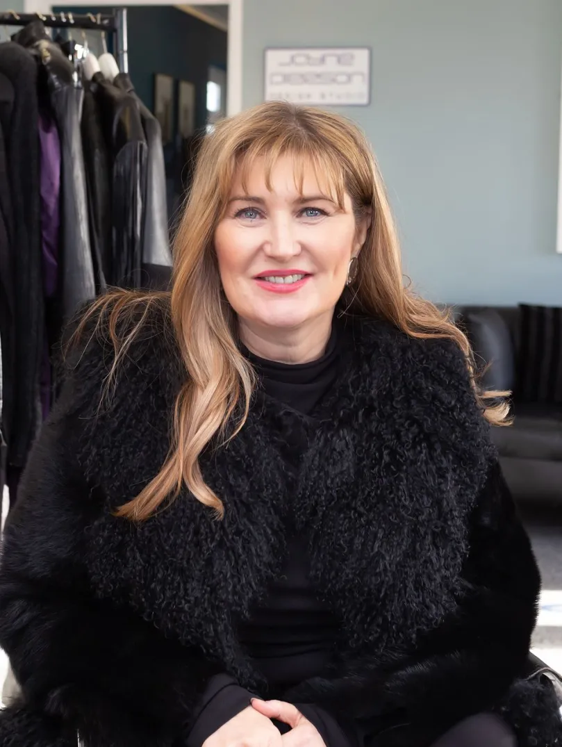 Fashion designer Jayne Pierson sitting in her fashion studio at Pembrey Airport