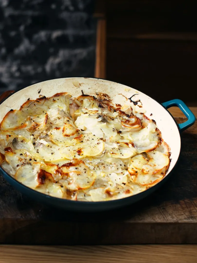 A beautifully presented cast iron pan with a freshly cooked Welsh onion cake
