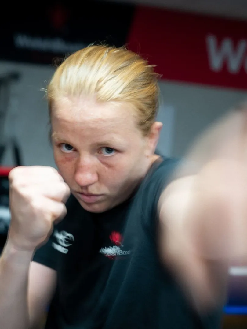 Rosie Eccles throws a punch during a boxing training session in a gym