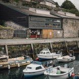 Boats moored alongside a picturesque quay area
