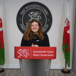 A woman standing at the Welsh Government podium.