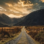A long slate track leading into the middle of beautiful mountains