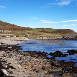 A view of Bardsey island from the shore.