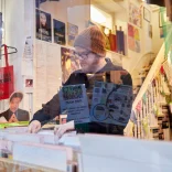 Huw Stephens looking through records in Spillers, Cardiff's Victorian Arcades