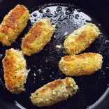 Glamorgan sausages frying in a pan