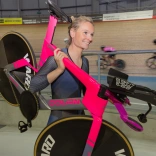 Ciara holding her bike over her shoulders