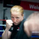 Rosie Eccles throws a punch during a boxing training session in a gym